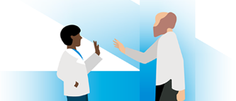Two healthcare professionals greet each other